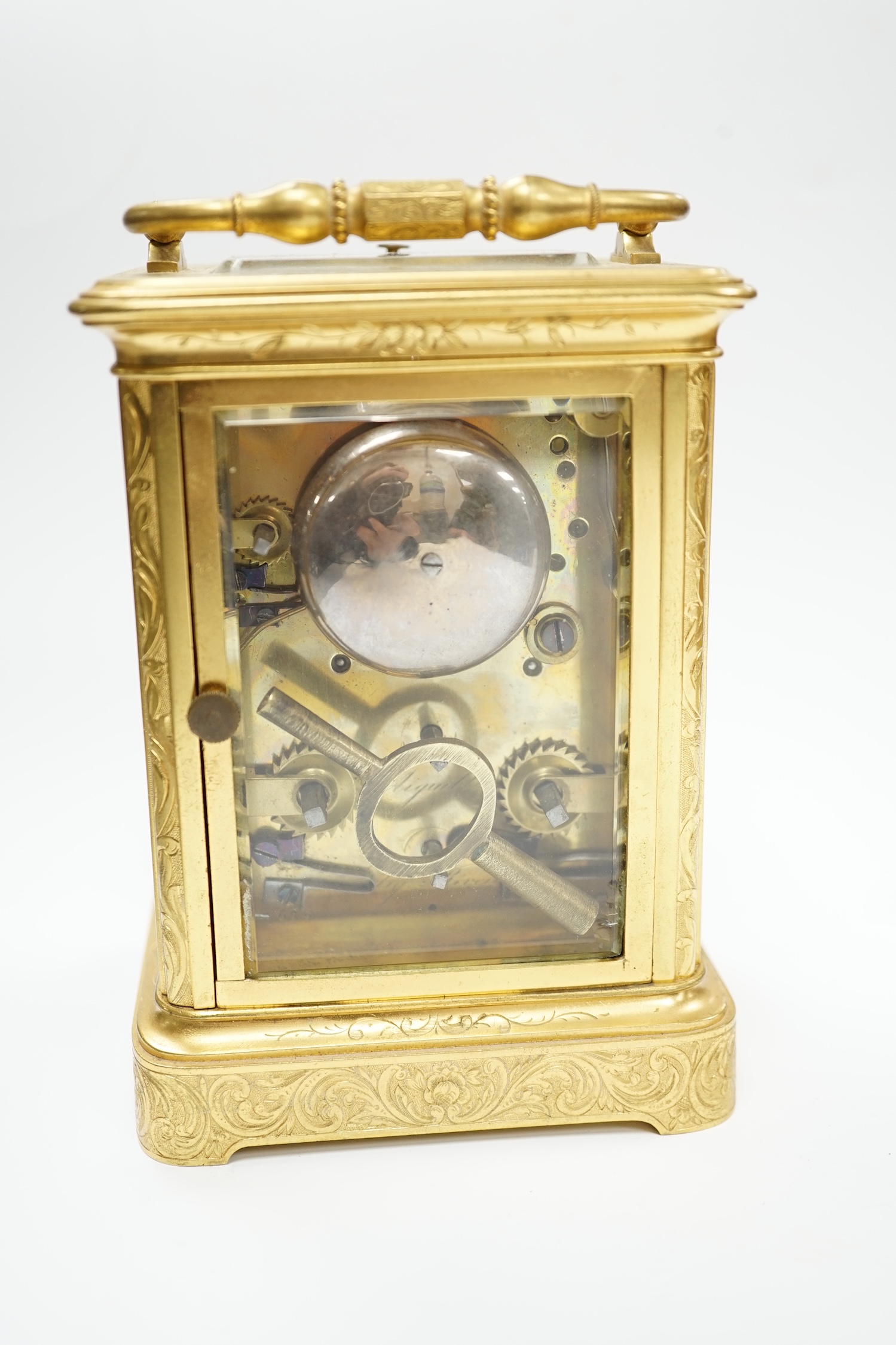 A late 19th century engraved brass cased repeating alarm carriage clock, dial signed Demeur, Her du Roi, Bruxelles, height 13cm.